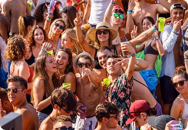 A full deck of guests dancing in the sun